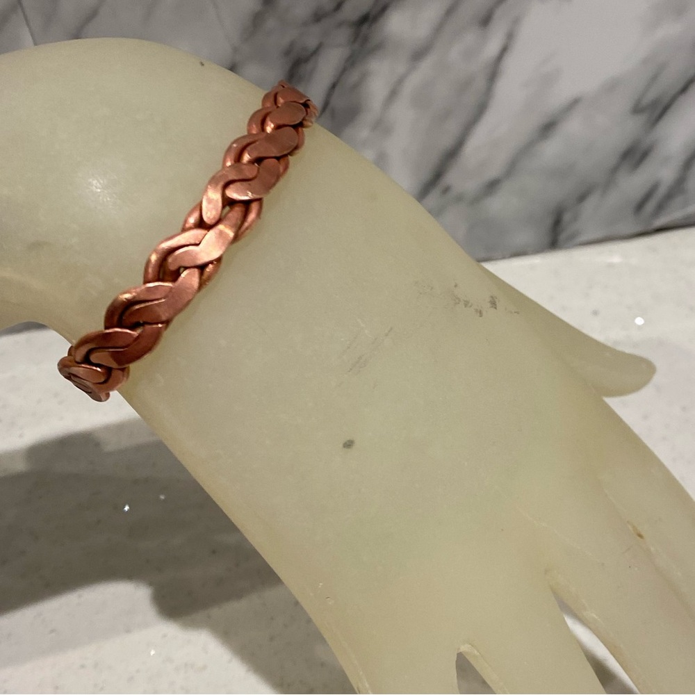 Copper bangle has cuff